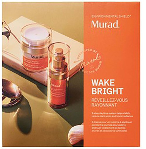Product packaging of Murad Wake Bright skincare with a small jar and a pump bottle on a white tray.