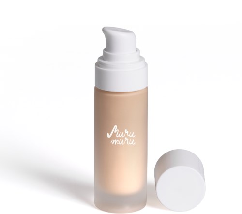 A beige-colored liquid foundation bottle with a white pump dispenser and a white cap.