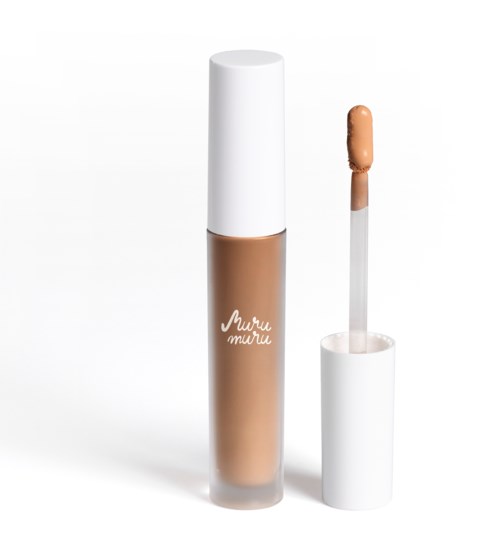 A beige liquid concealer in a tube with a removable white cap and a brush applicator.