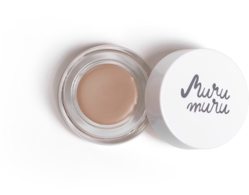 A small jar with beige cream and a white lid that has 'Muru muru' written on it.