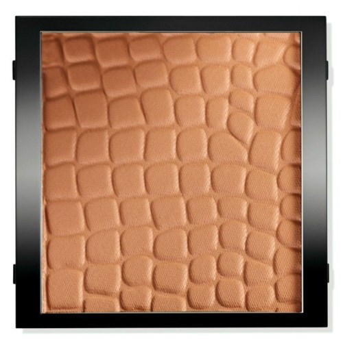 En texturerad, orangefärgad yta med ett mönster som liknar pusselbitar inom en svart kvadratram.