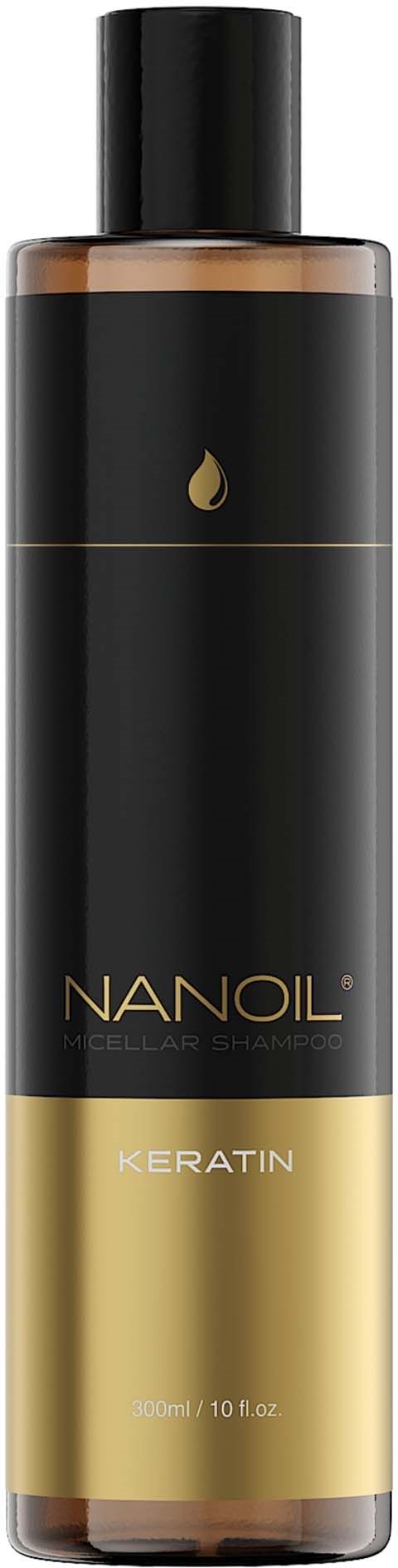 Black and gold bottle of Nanoil Keratin hair treatment. It is tall and cylindrical. The label shows the product name and brand.