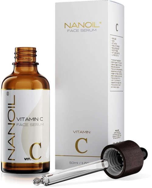 A small amber bottle labeled 'Vitamin C Face Serum' with a dropper. A box with the same label is behind it.