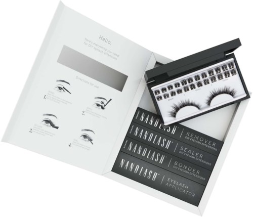 Een doosje met nepwimpers, instructies en vier verschillende soorten wimperextensions in een boekje.
