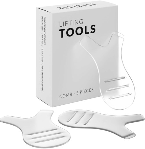 De set bevat drie kleine witte hefgereedschappen met handvat, buiten en voor de doos met 'Lifting Tools' erop.