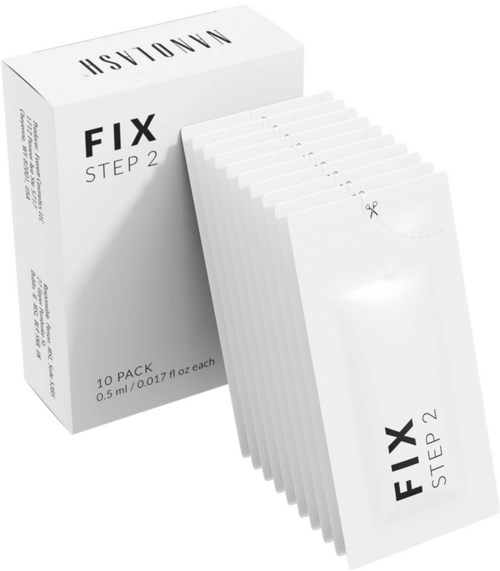 Een doos met 10 kleine zakjes gemarkeerd 'FIX STEP 2' met een schaarpictogram, waarschijnlijk voor een schoonheids- of gezondheidsproduct.