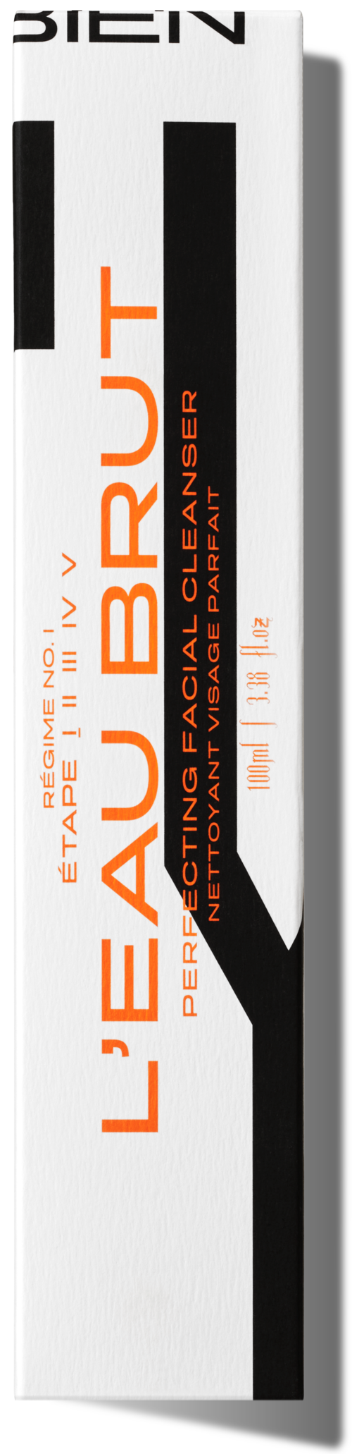 Eine weiße Schachtel mit schwarzen und orangefarbenen Text, zeigt ein Gesichtspflegeprodukt namens L'EAU BRUT.