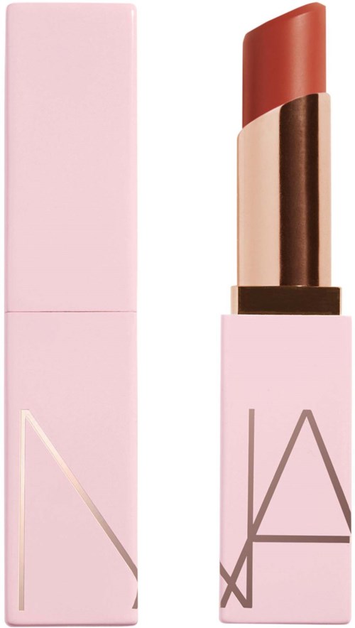 A pink lipstick in a light pink case with a logo on it. The lipstick is brownish red.