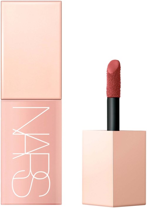 Pink lipstick in a square container with NARS branding, open to show the lipstick.