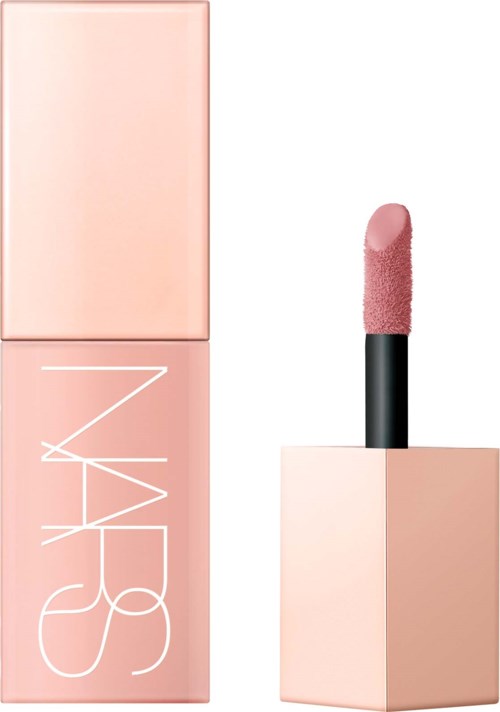A NARS lipstick with pink color and a black tube, placed next to its pink box.