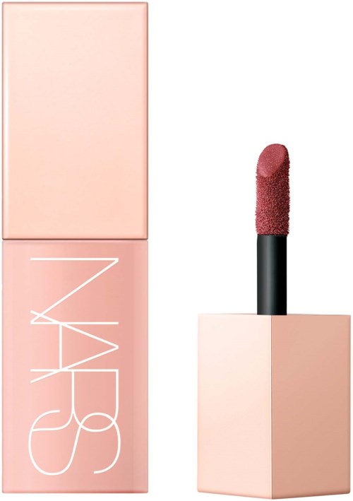 A light pink NARS lipstick with a sponge-tip applicator in a matching pink square case.