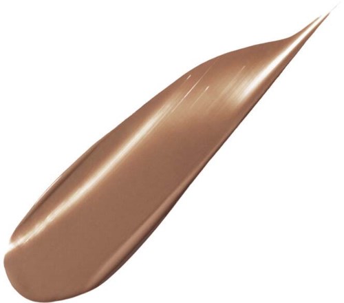 En stor, slät, brunt färgad blad med spetsigt tips och synliga venen.
