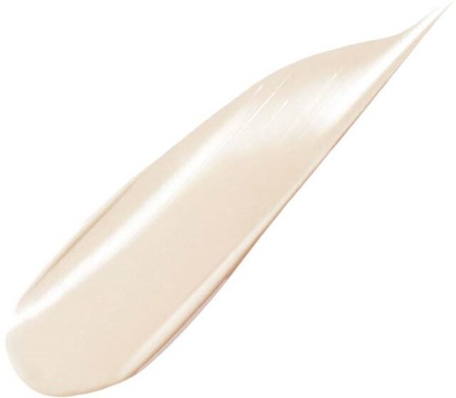 En vit eller ljus beige krämig substans på en slät yta, möjligen en lotion eller kräm, med ett svagt sken.