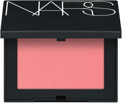 A NARS blush compact with a pink blush inside and a black lid with white brand logo.