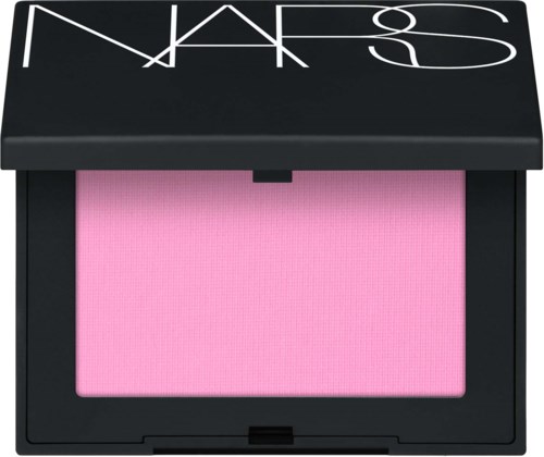 A pink blush powder inside a black compact with a NARS logo on the lid.