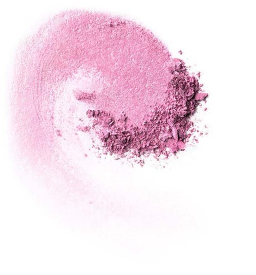 Rosa puder make-up utbredd i en lös cirkel på en vit bakgrund.
