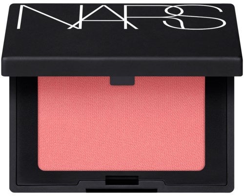 A NARS blush compact with a pink blush inside and a black lid with white logo.