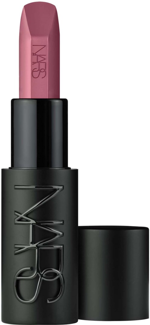 A pink lipstick in a black tube with the NARS logo embossed, with the cap removed showing the lipstick.