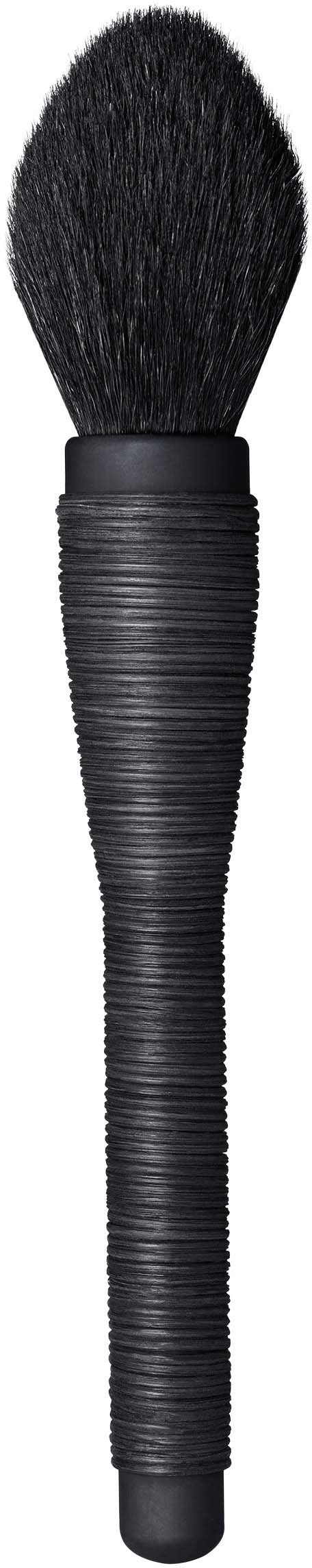 A black makeup brush with a rounded top and a long, slim handle. The handle has a ribbed texture.