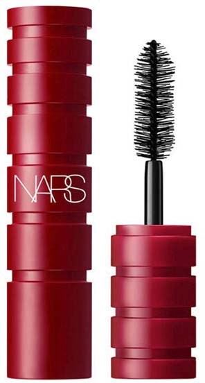 A red cosmetic tube with a brush-like applicator, part of NARS makeup product line.