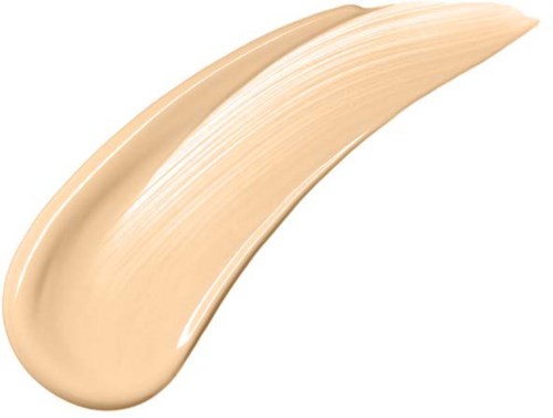 A beige-colored cream or foundation with smooth, thick texture on a white background.