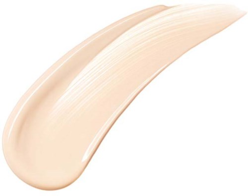 A beige-colored creamy substance with a smooth, slightly curved texture. It looks like a cosmetic or skincare product.