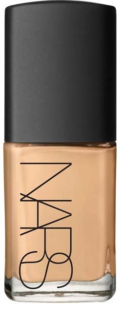A NARS foundation bottle with a black cap and beige makeup liquid inside.