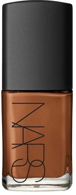 A bottle of NARS foundation with a black cap and brown liquid inside.