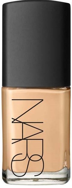 A bottle of NARS foundation with black cap, beige liquid inside, and brand name on the front.