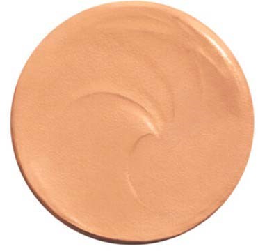 A round, beige makeup foundation with a smooth, creamy texture and slight swirl pattern.