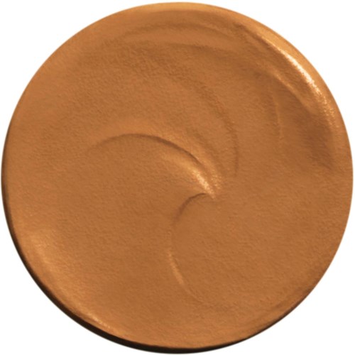 A round, orange-brown makeup compact with a smooth, slightly shiny surface.