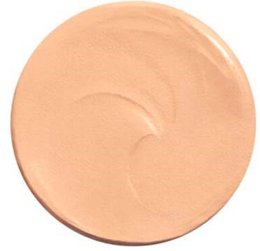 A circular beige makeup product with a smooth surface and a pump dispenser, likely foundation or primer.