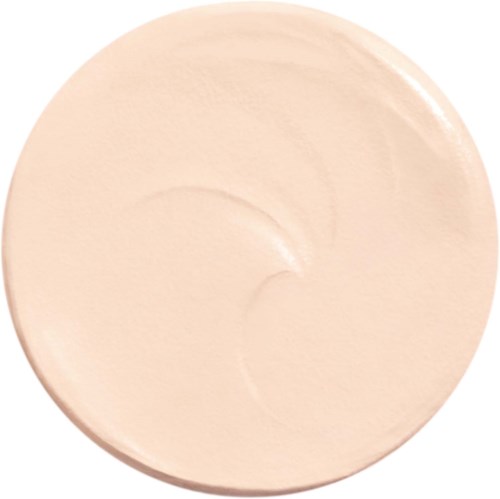 A small, round dish with a smooth, light-colored creamy substance inside.