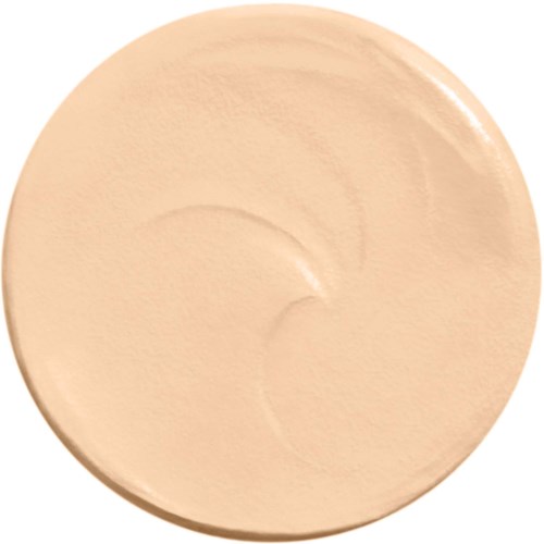 A circular, beige-colored object with smooth, slightly shiny surface and faint swirl marks.