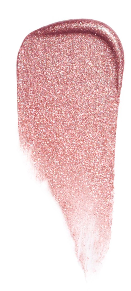 Pink glitter eyeshadow swatch smudged from the center towards the edges.