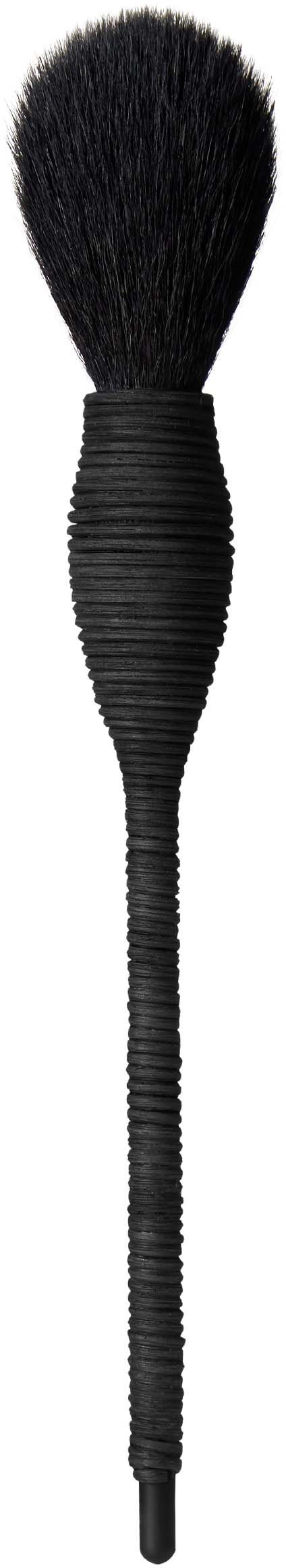 A makeup brush with a round, fluffy top and a long, textured handle.