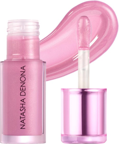 Kleine pinke Nagellackflasche mit Pinsel und Lackstrich im Hintergrund.