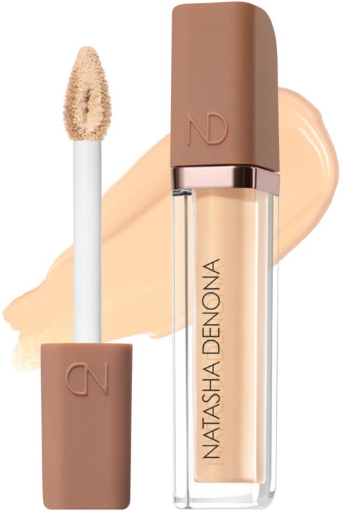 Läppglansapplikator med beige nyans och en genomskinlig flaska med namnet Natasha Denona.