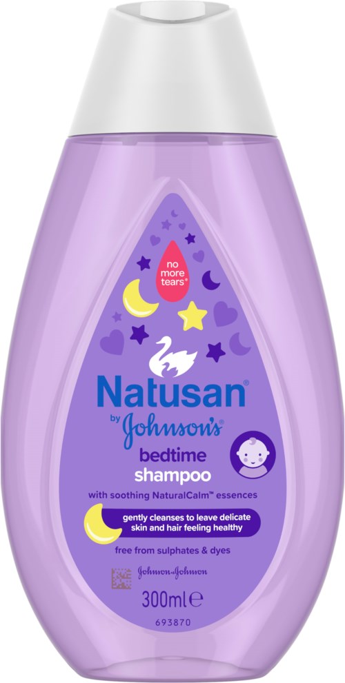 Lavender shower bottle with a label showing moons, stars, and a swan, indicating it is bedtime shampoo for children.