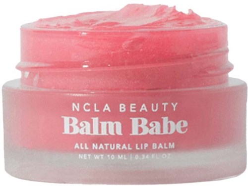 A pink lip balm jar with white text, showing the brand name and product description.