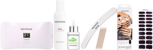 Nail care kit includes a lamp, cleaner, cuticle oil, file, gel stickers, and tools for nails.