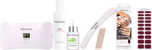 Nail care kit with USB LED lamp, nail cleaner, gel stickers, and various tools for manicures.