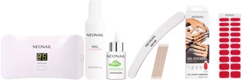 A set of nail care products, including a lamp, cleaner, nail oil, stickers, and gel strips for manicures.