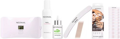 A collection of nail care products including a digital device, cleaner, cuticle oil, files, gel stickers, and adhesive strips.