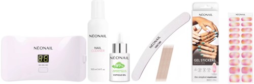 Nail care kit includes a display device, nail cleaner, cuticle oil, nail file, gel tips, and stickers.