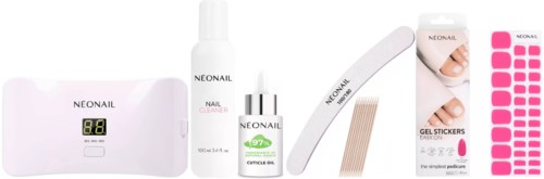 A nail care set includes a UV lamp, nail cleaner, cuticle oil, gel stickers, and nail files.