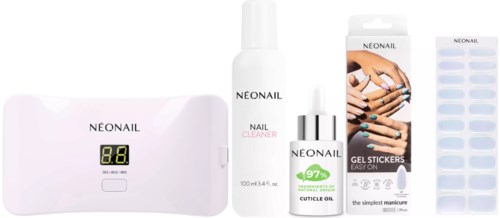 Various nail care products including a nail dryer, cleaner, cuticle oil, gel stickers, and tools.