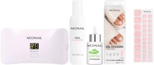 Various nail care products including a UV lamp, cleaner, cuticle oil, nail stickers, and a spray bottle.