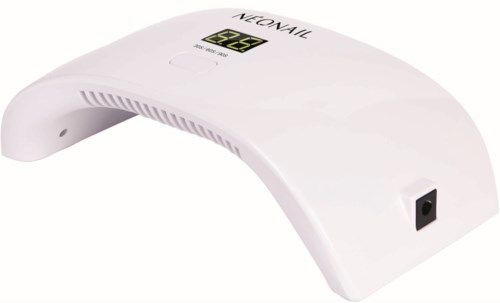 A white nail lamp with a digital display, used for curing gel nails.