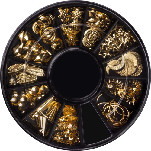 A round container with small compartments filled with shiny gold and silver nail art decorations and embellishments.